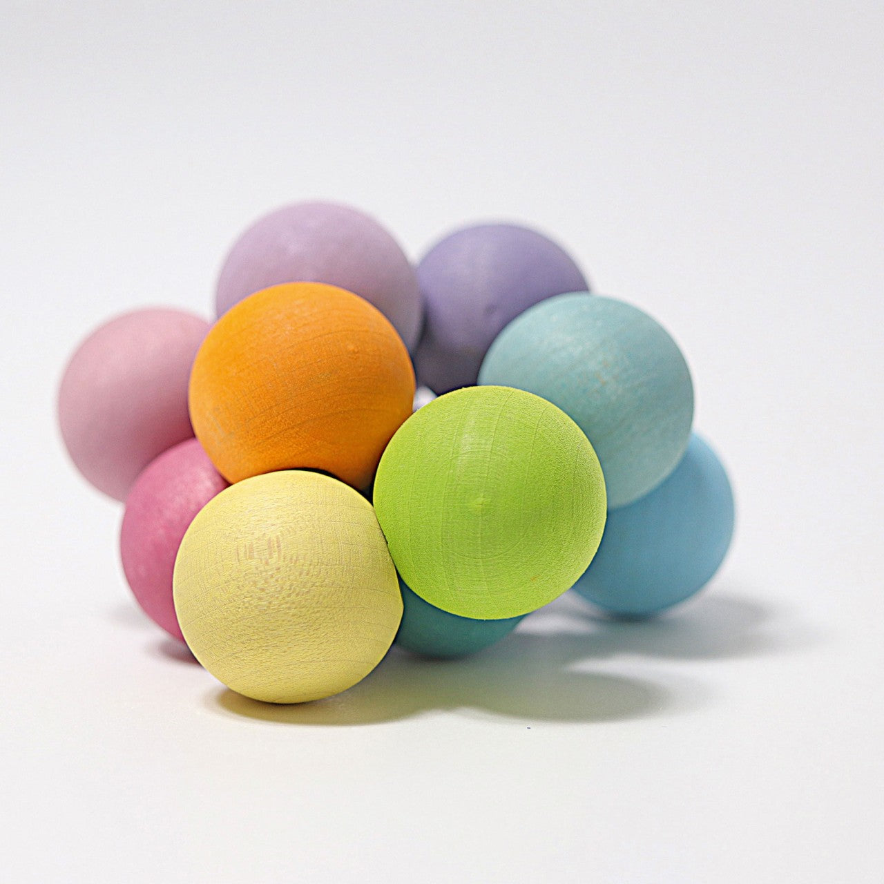 Greifling Regenbogen, pastell, Holz | Grimms