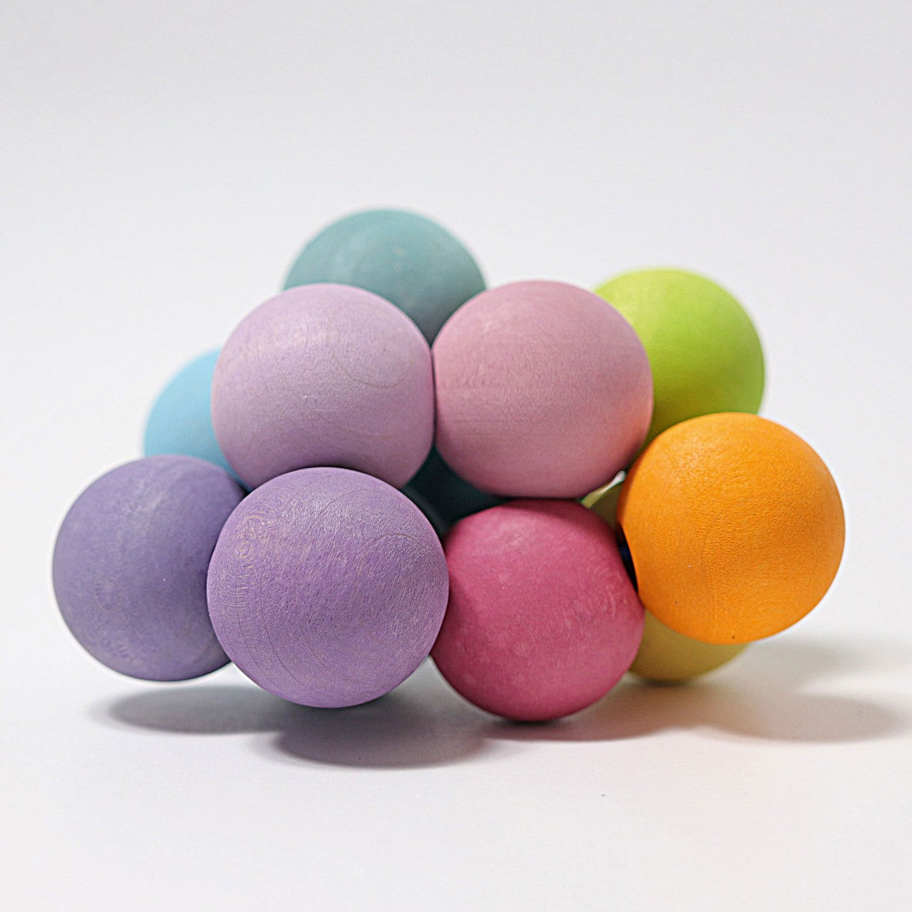 Greifling Regenbogen, pastell, Holz | Grimms